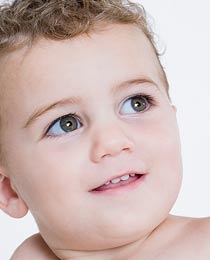 photo of a baby with her first teeth coming in
